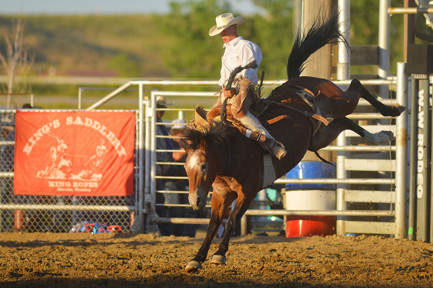 Jake Schlattman holds himself center over his saddle bronc horse